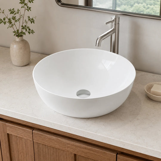 Round ceramic countertop basin installed in a styled bathroom — lifestyle scene, SANIKB SN157.