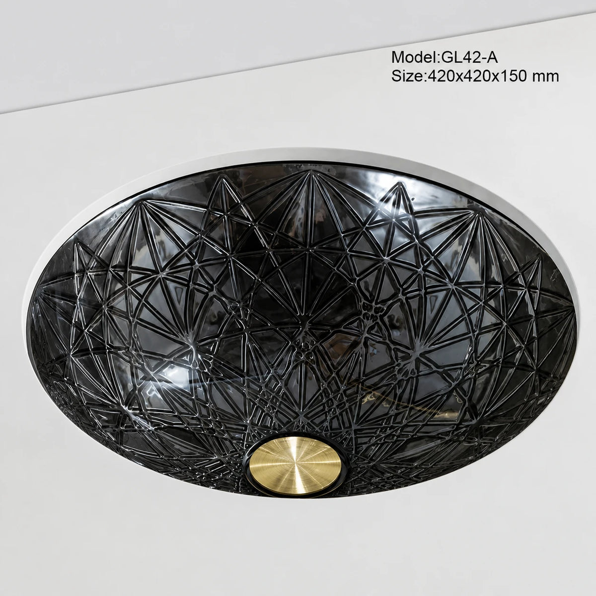 Undermount smoke grey faceted glass basin, round 420mm starburst-cut bowl installed below counter