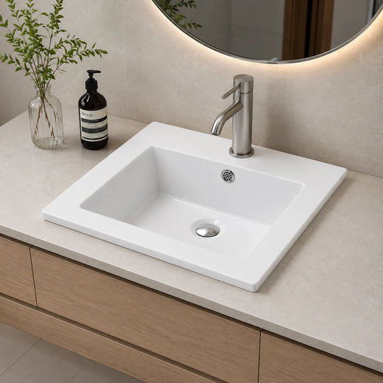 Square ceramic vanity sink installed in a styled bathroom — lifestyle scene, SANIKB SN1546.