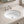 Undermount bathroom sink installed in a styled bathroom — lifestyle scene, SANIKB SN004.