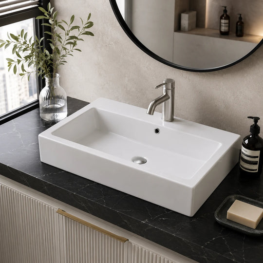 Wide rectangular ceramic vessel sink installed in a styled bathroom — lifestyle scene, SANIKB SN144.